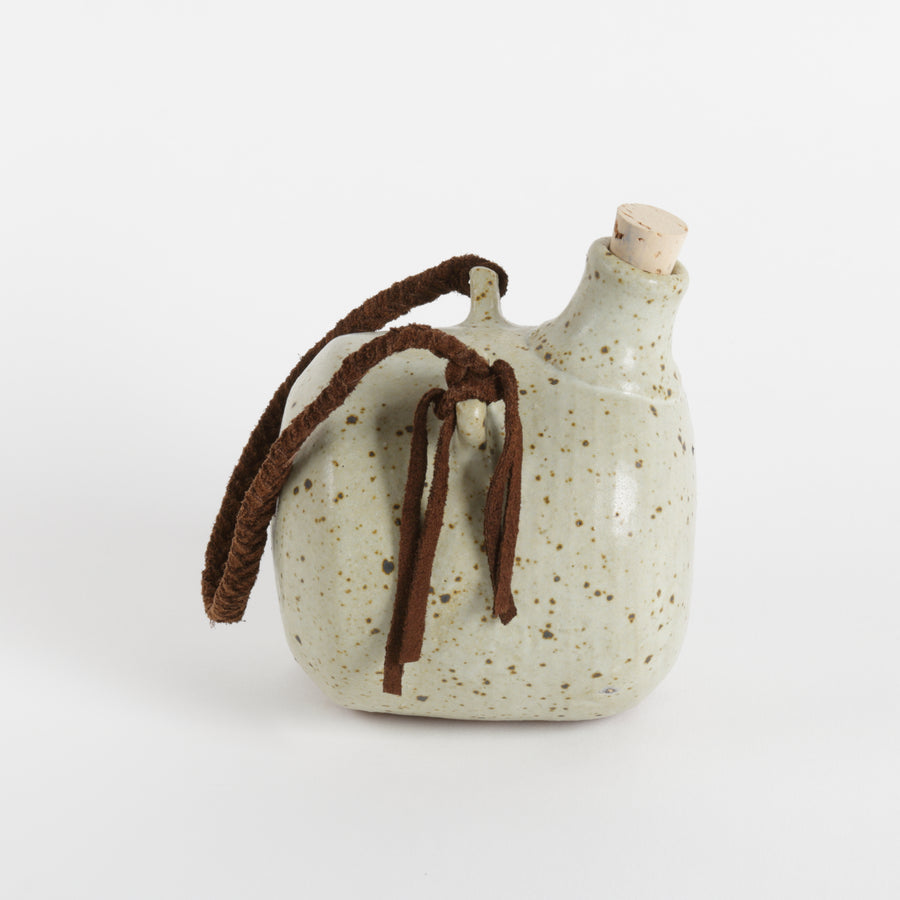 Studio pottery handing flask with cork and braided suede strap